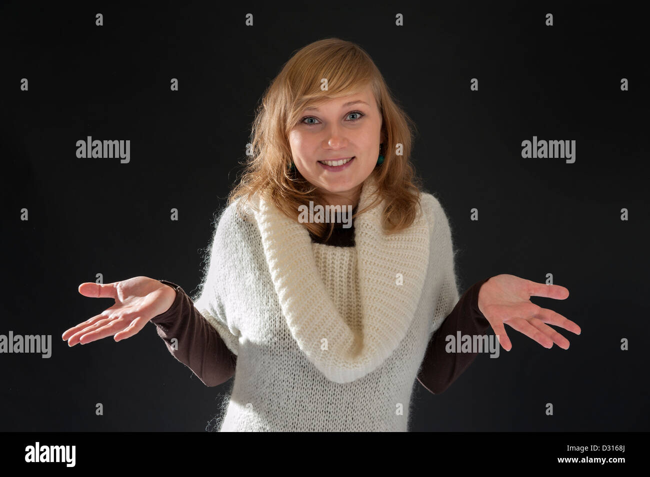 young blond woman doing a helpless gesture Stock Photo