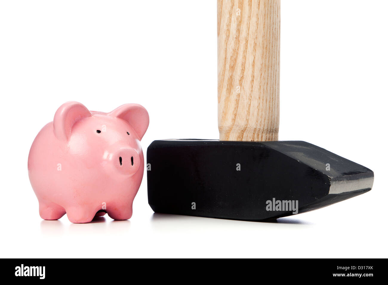 Small pink piggy bank and sledgehammer Stock Photo