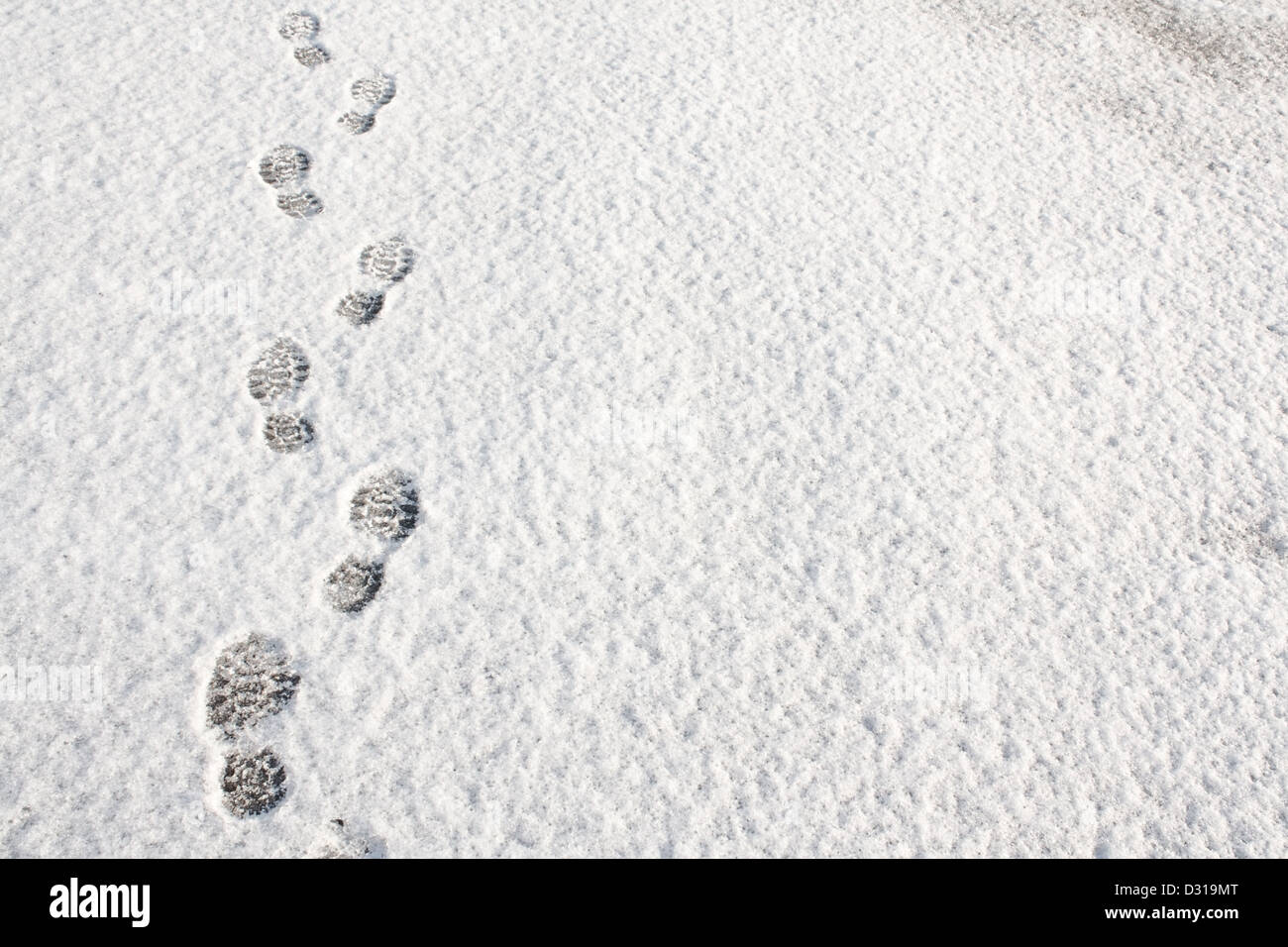 Footprints in fresh snow background great concept for winter footwear Stock Photo