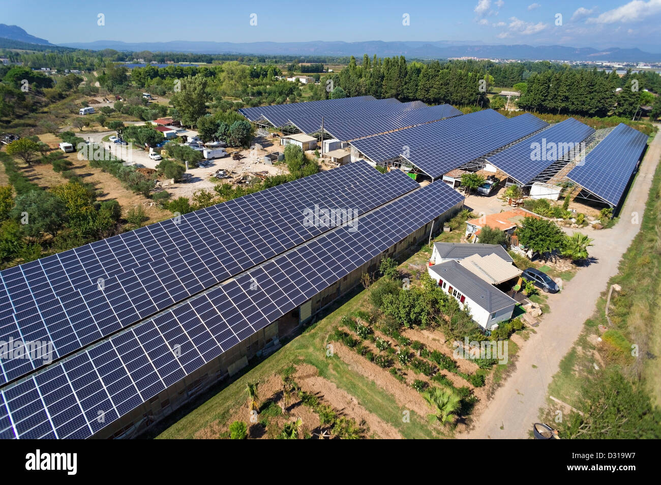Solar panels on commercial greenhouses for food production, aerial view, Roquebrune-sur-Argens, Var region, France Stock Photo