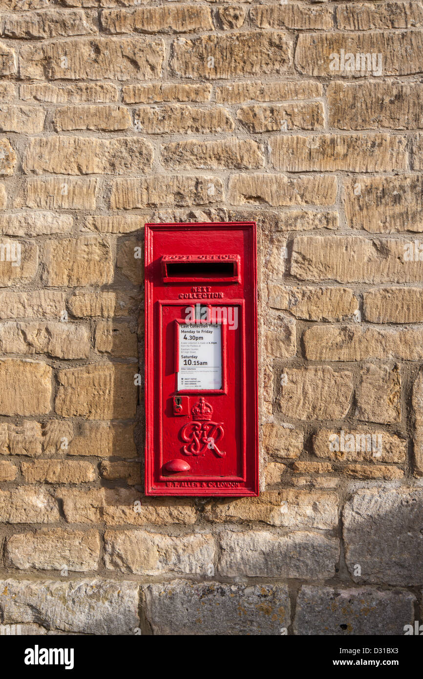 British red letter box on cotswold stone wall, Worcestershire, England