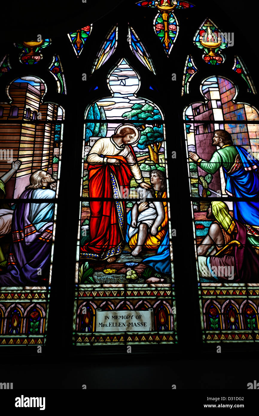 jesus healing the sick stained glass window in holy rosary cathedral Vancouver BC Canada Stock Photo