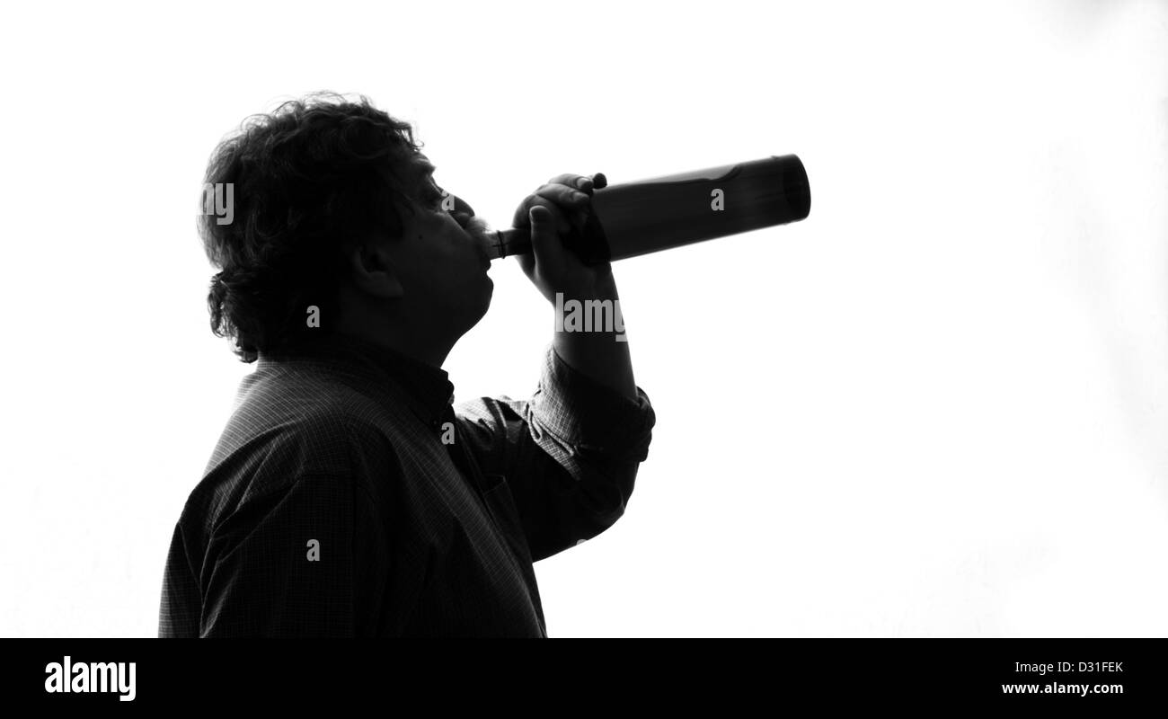 man drinking wine from a bottle, black and white Stock Photo