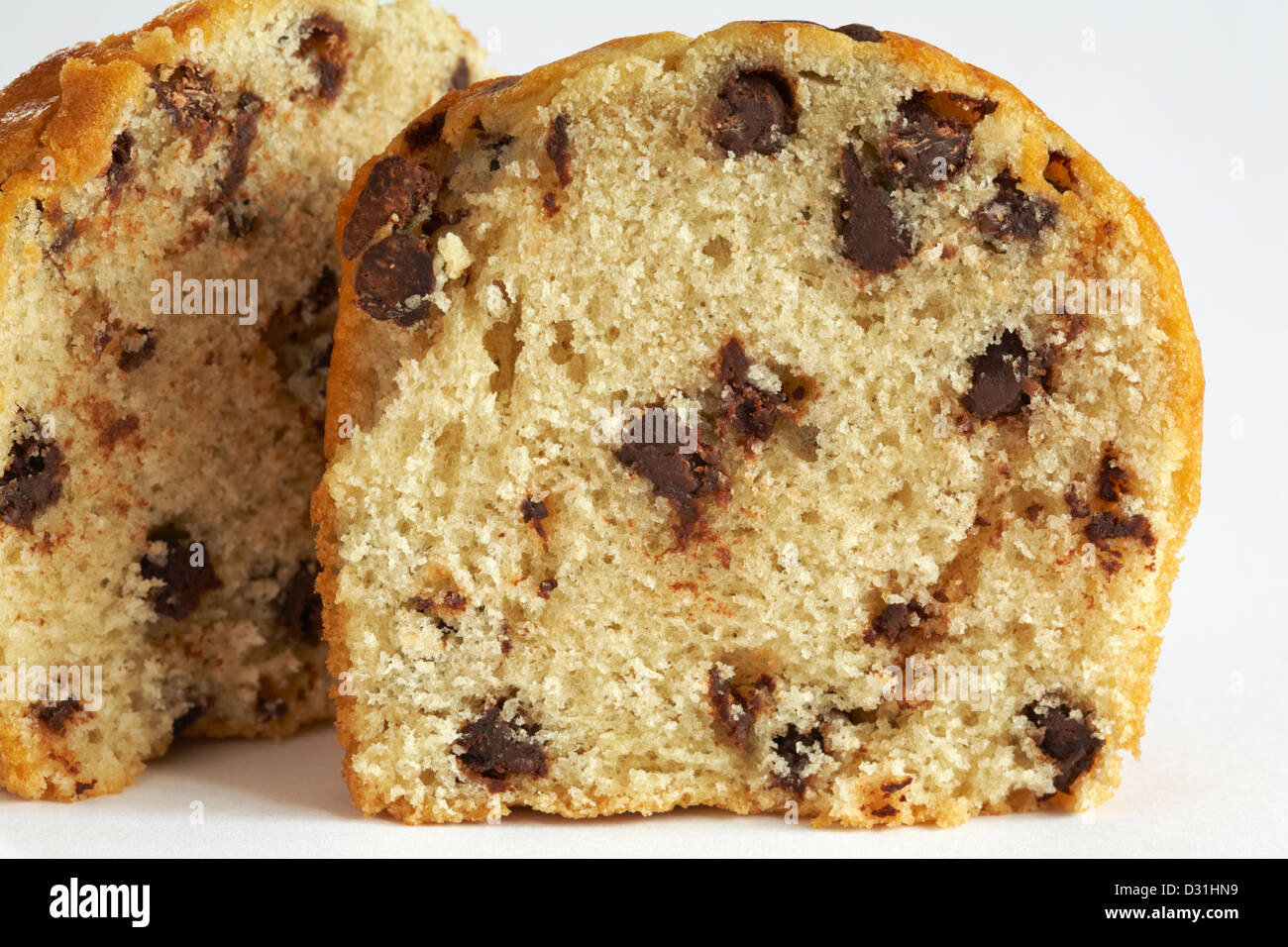 chocolate chip muffin cut in half set on white background Stock Photo
