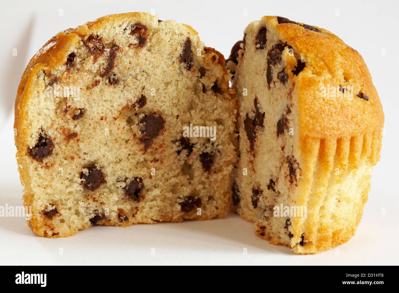 chocolate chip muffin cut in half isolated on white background Stock Photo