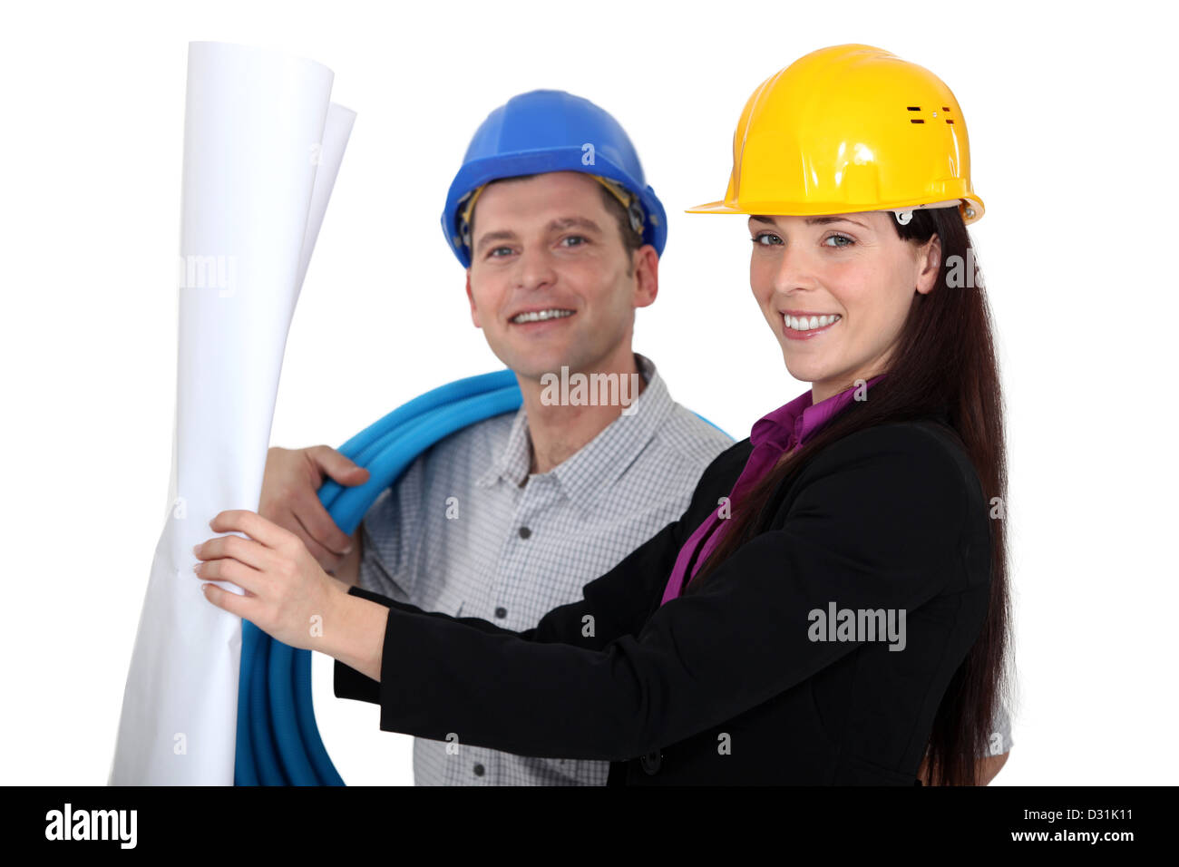 businesswoman and craftsman looking at a blueprint Stock Photo - Alamy