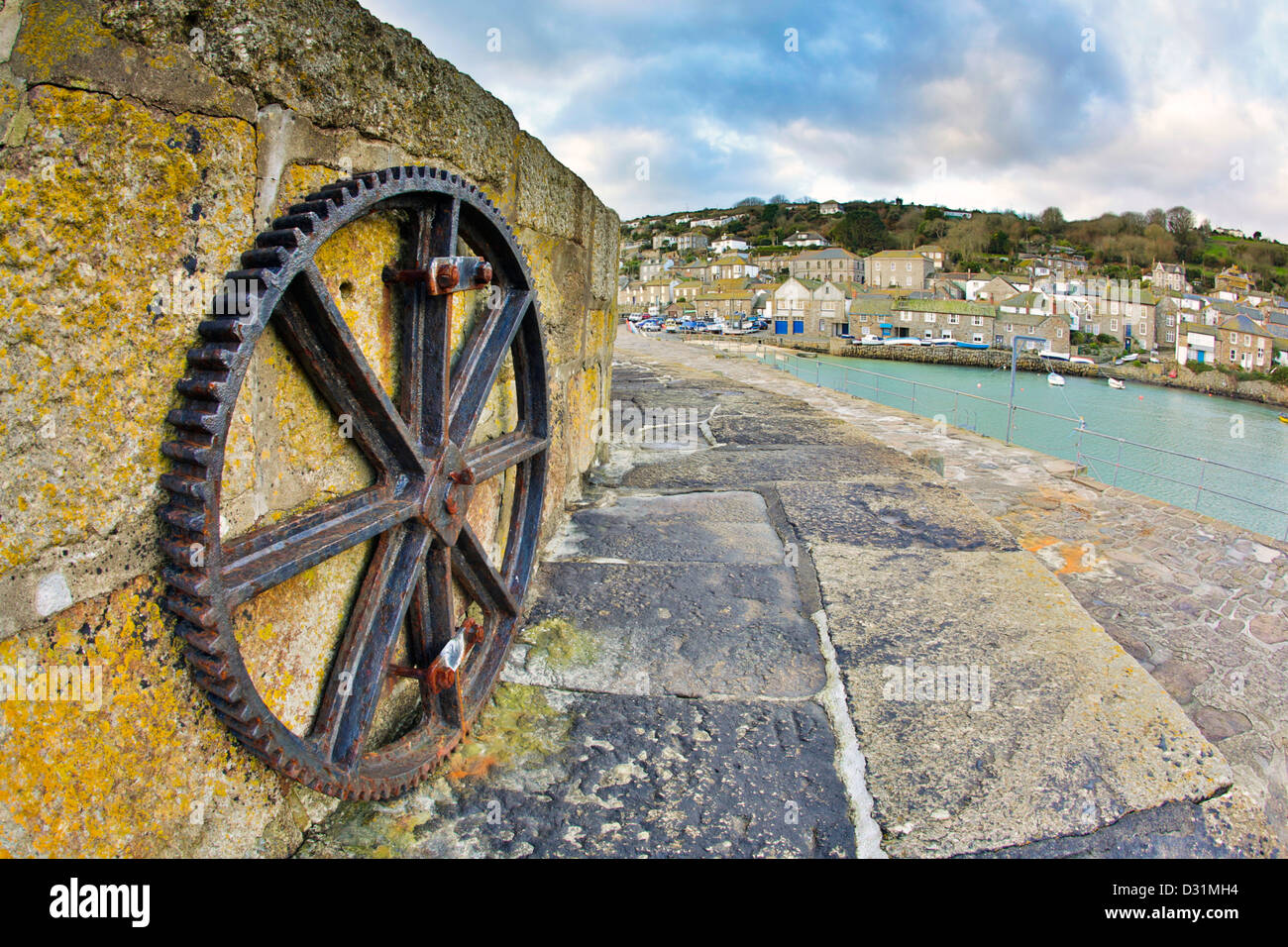 Mousehole; Cornwall; UK; Wheel on Harbour Wall Stock Photo