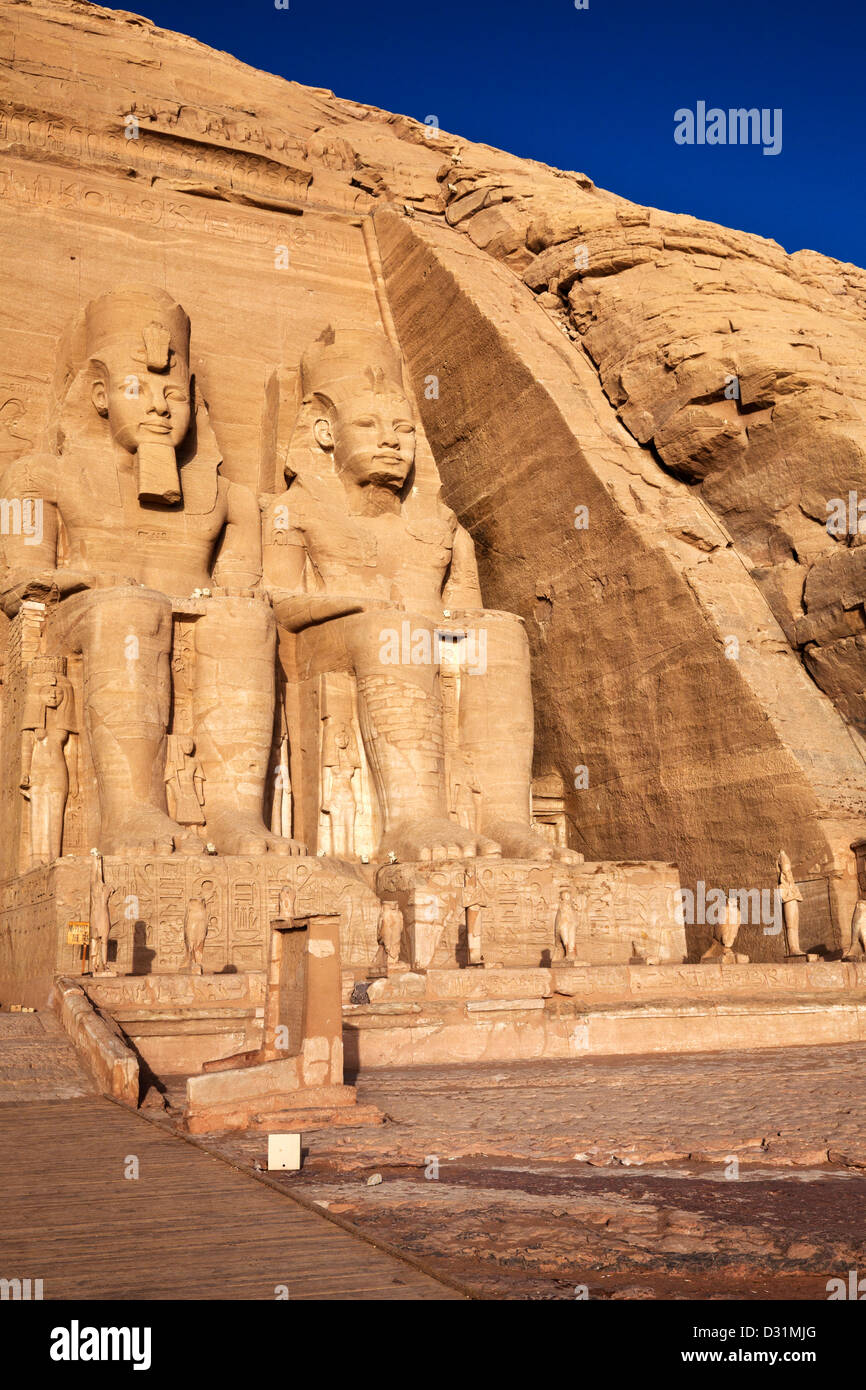 Statues of pharaoh Ramesses II wearing the double Atef crown of Upper and Lower Egypt at Abu Simbel Stock Photo