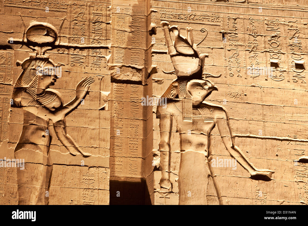 Sound and Light Show on Isis Temple at Philae, Aswan, showing hieroglyphs and bas-relief of Isis and Horus Stock Photo