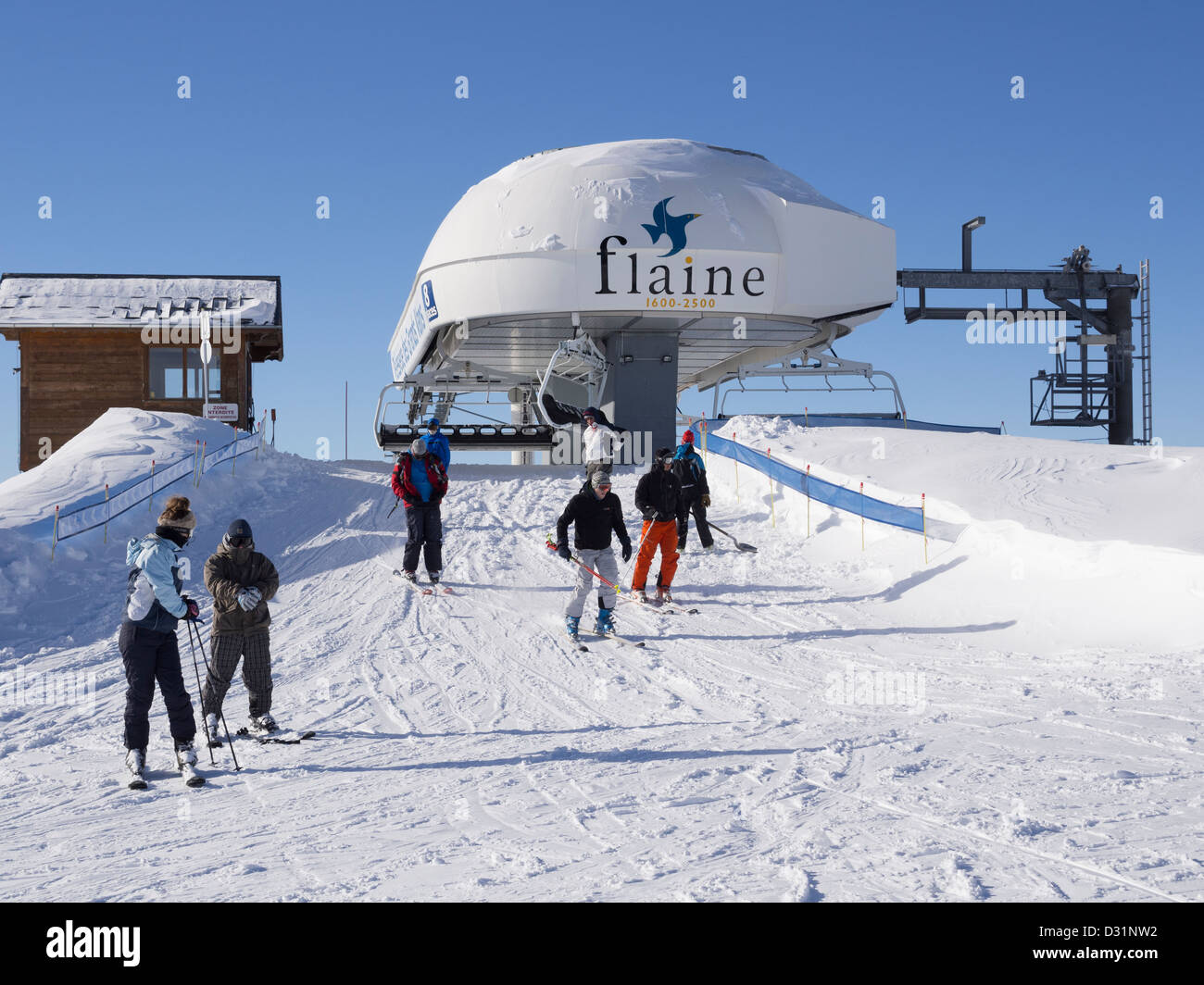 Skiers disembarking at top of Grands Vans chairlift in Le Grand Massif ski  area in the French Alps. Flaine, Rhone-Alpes, France Stock Photo - Alamy