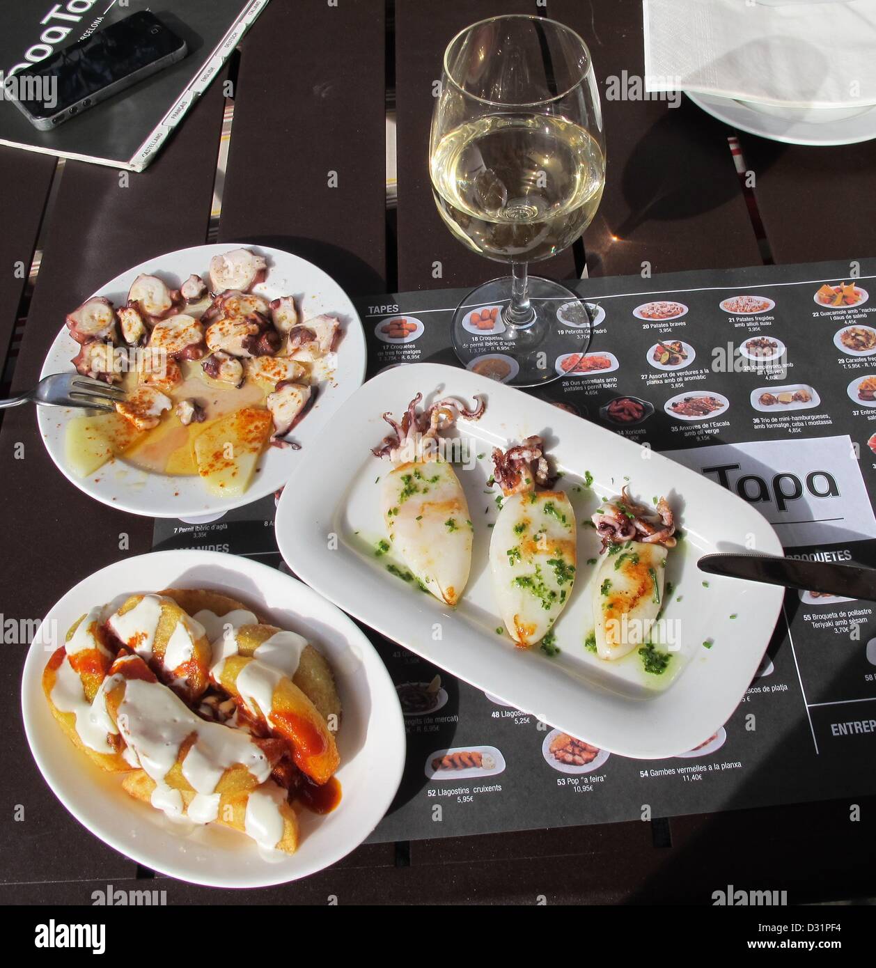 Tapas are served on a table in a restaurant in Barcelona, Spain, 29
