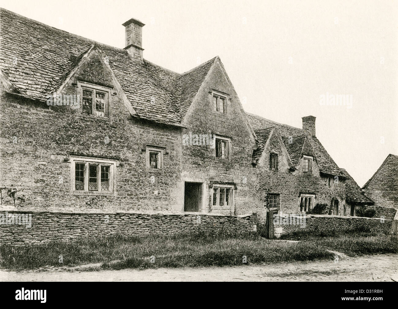 A collotype plate entitled ' Cottages at Awkward Hill, Arlington, Glos.' scanned at high resolution from a book published in 190 Stock Photo