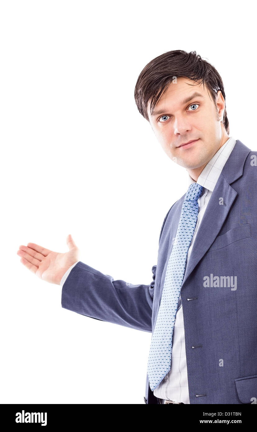 Young business man with arm out in a welcoming gesture isolated on white Stock Photo