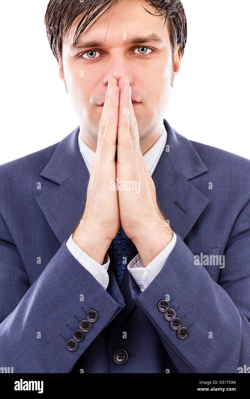 Serious businessman holding both hands in front of his mouth against white Stock Photo