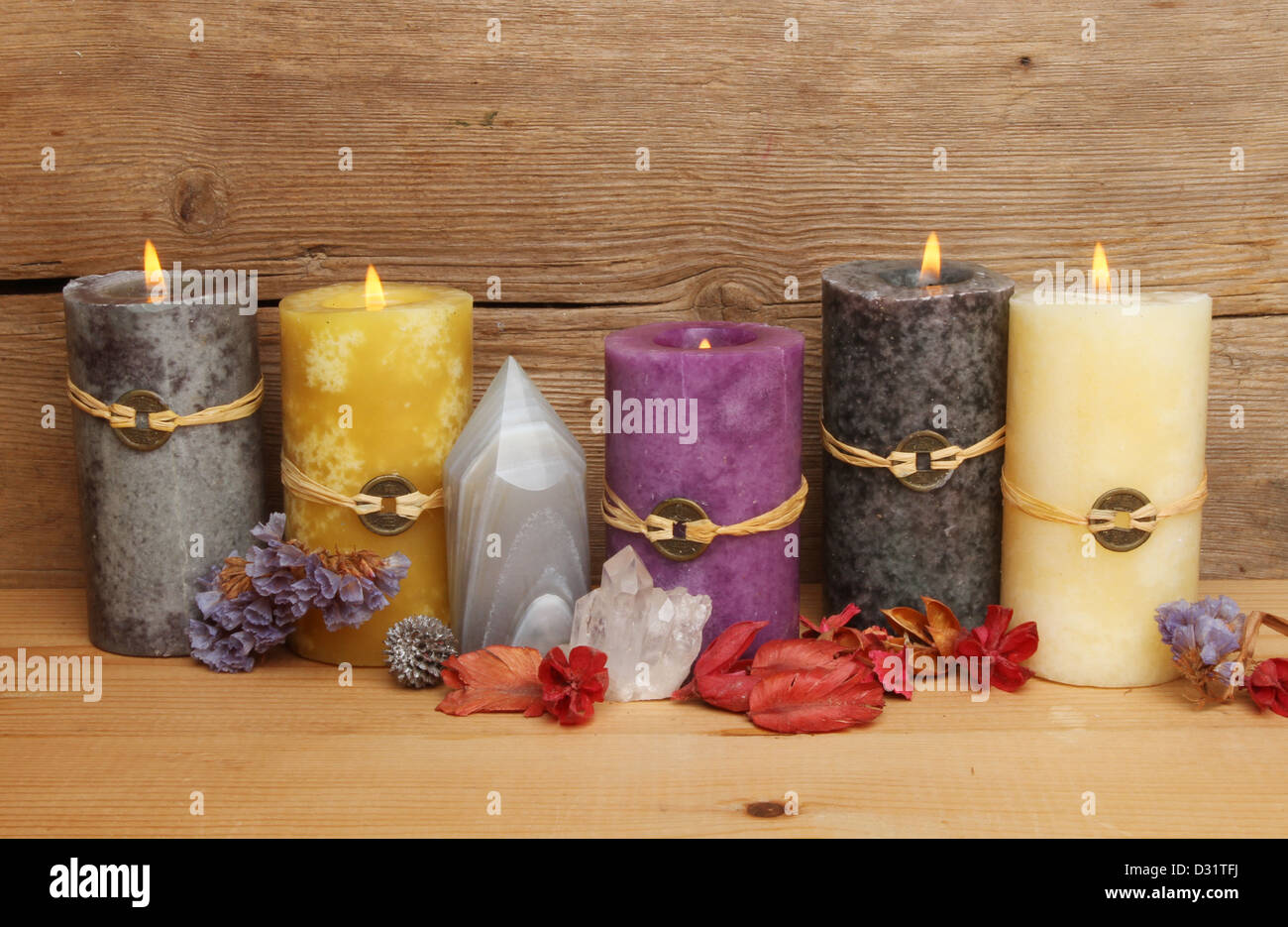 Burning Feng Shui candles, crystals and potpourri against a background