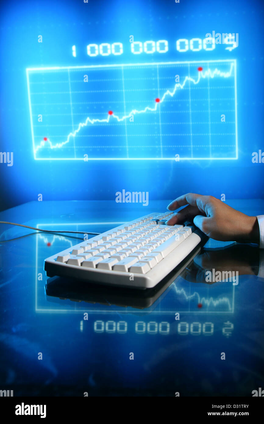 businessman input finance data information on keyboard Stock Photo