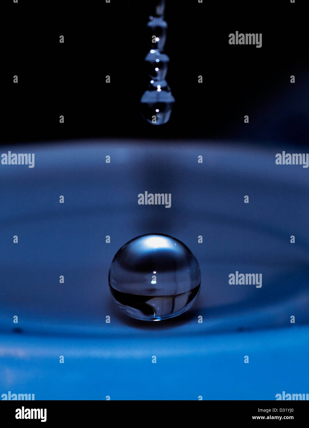 High-speed, macro photograph of a water droplet Stock Photo