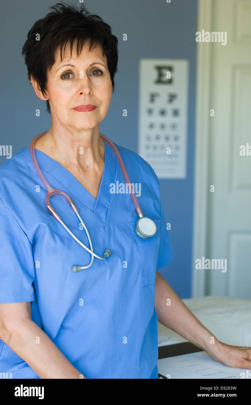 Caucasian nurse standing in doctor's office Stock Photo Alamy