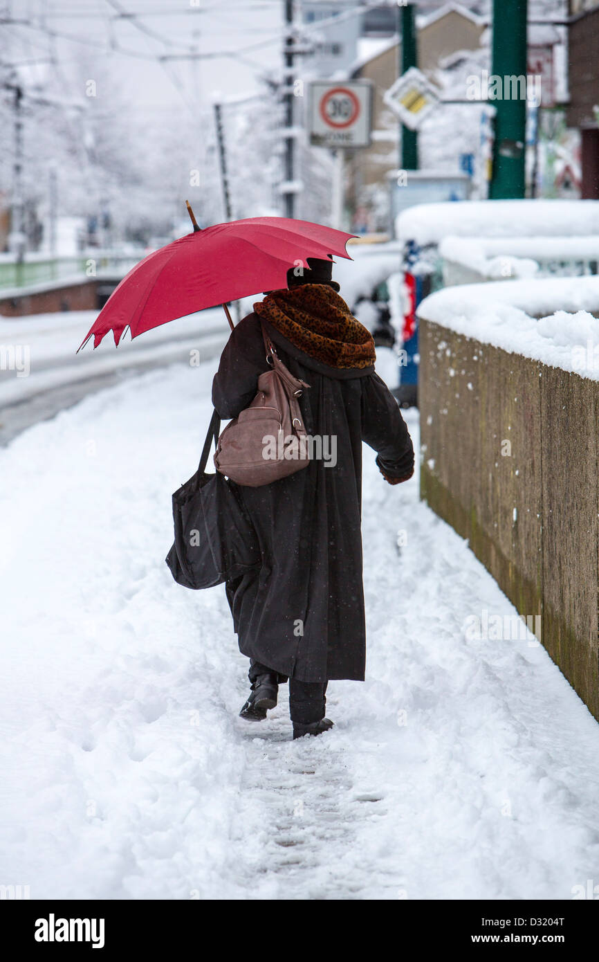 Red umbrella winter snow hires stock photography and images Alamy