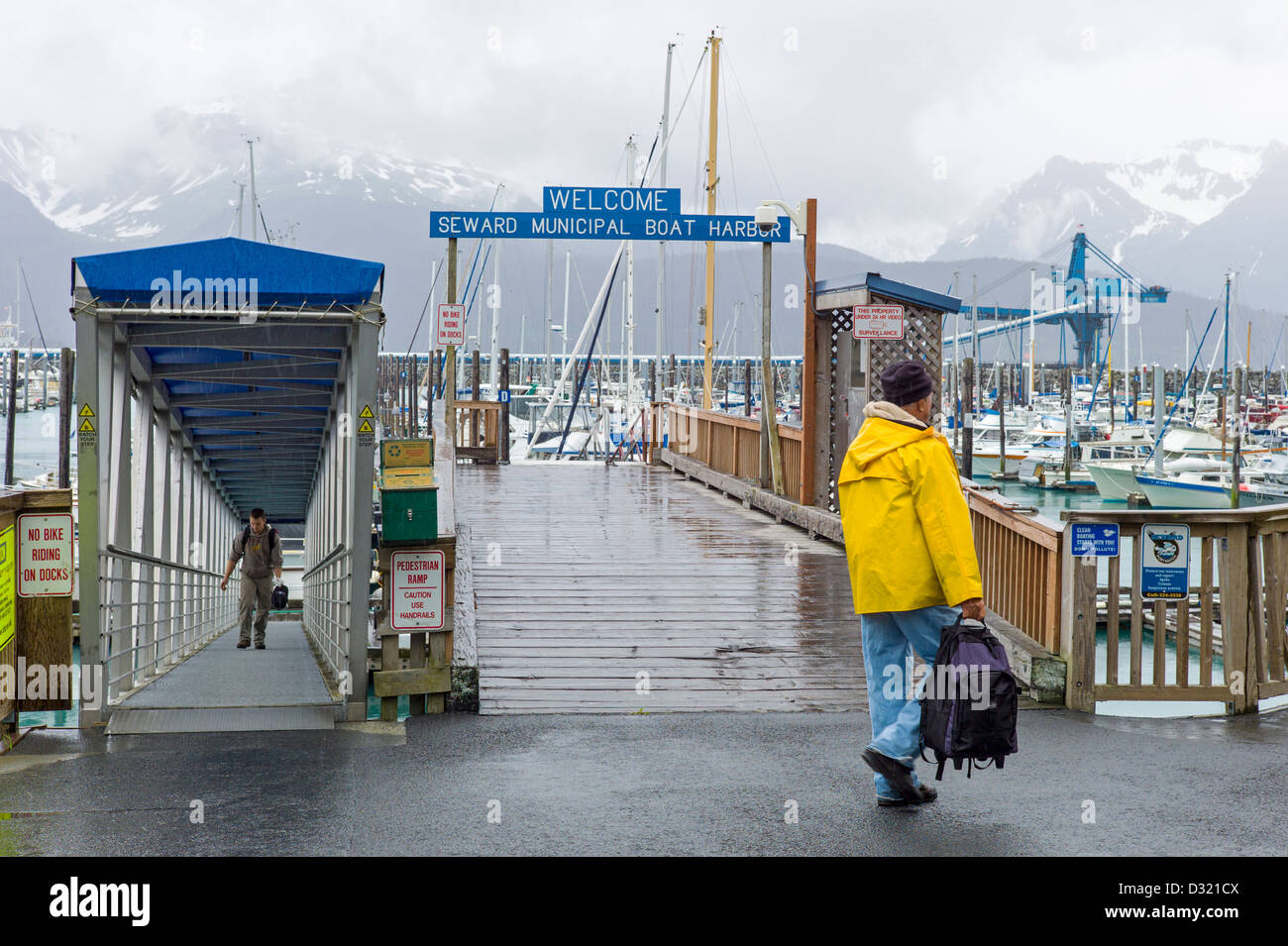 Fisherman and charter boat captains bringing in their catch of the day on the docks of Seward, Alaska, USA Stock Photo