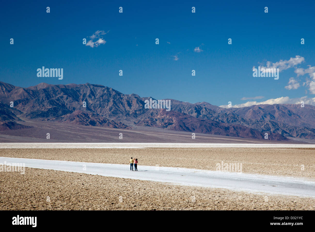 Death Valley National Park, California - Tourists on the salt flat in Badwater Basin. Stock Photo