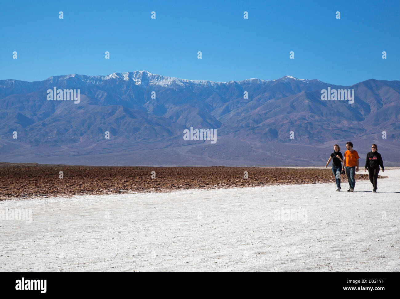 Death Valley National Park, California - Tourists on the salt flat in Badwater Basin. Stock Photo