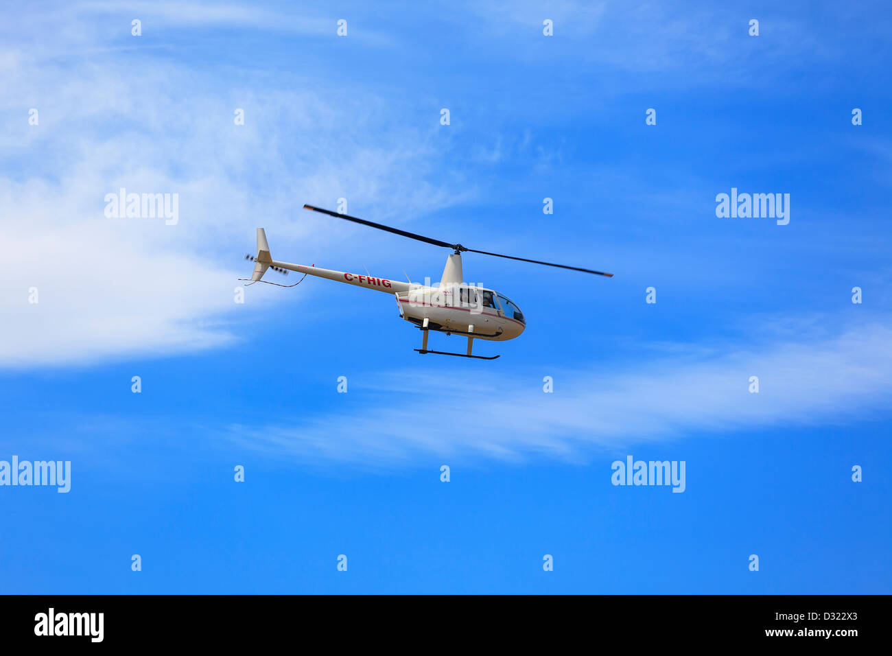 Robinson R44 Helicoptor in flight Stock Photo