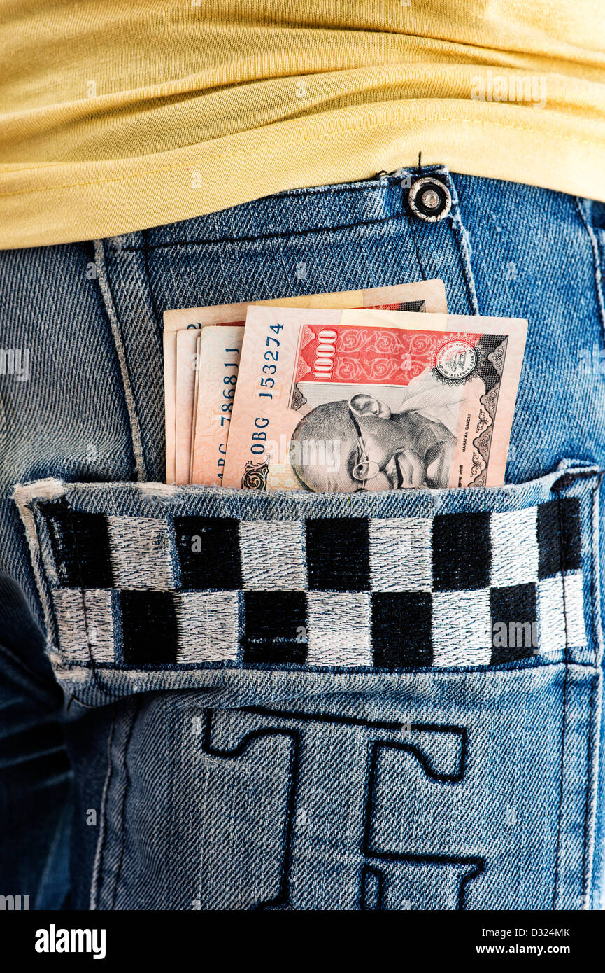 Rupee notes in an Indian mans jean back pocket. India Stock Photo