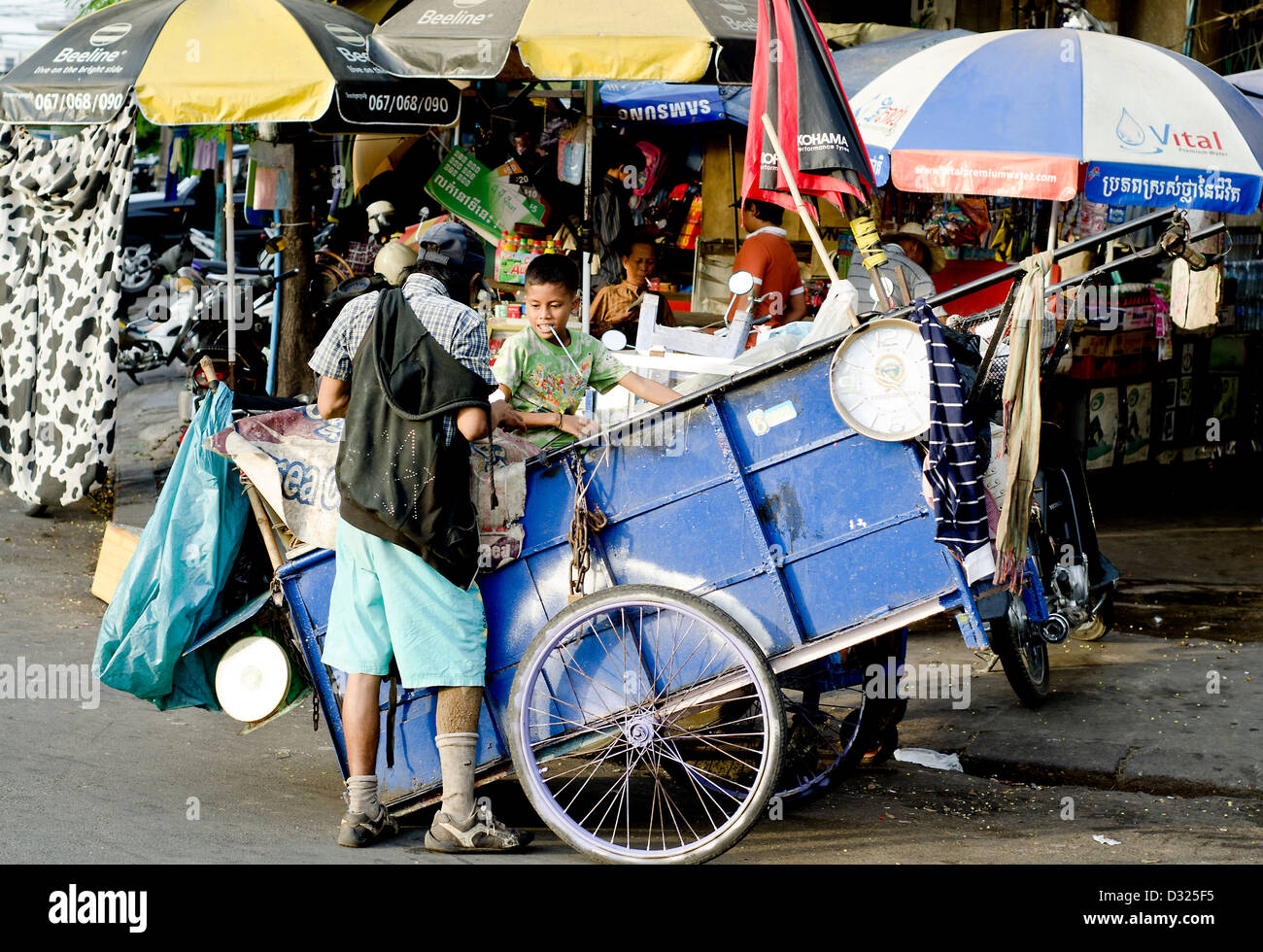 Garbage man outside Central Market,  Phnom Penh Stock Photo