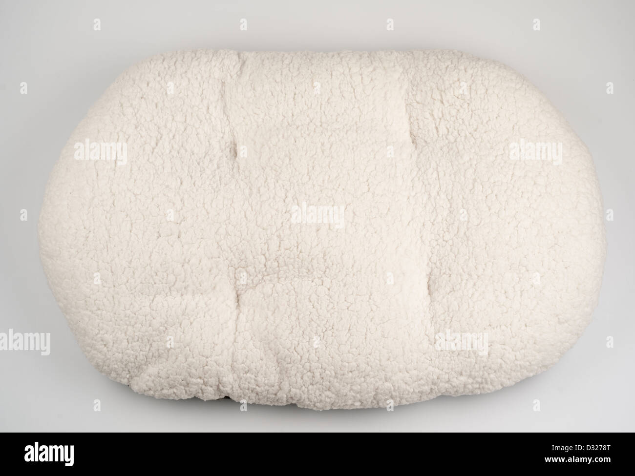 Plump oval cushion dog bedding Stock Photo