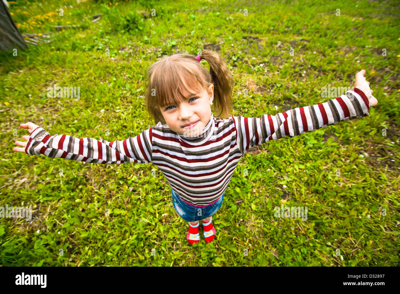 Funny lovely little girl in the park Stock Photo - Alamy