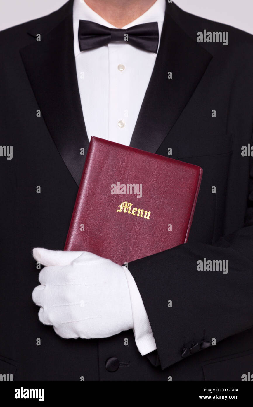 Waiter holding a Menu folder in a restaurant. Stock Photo