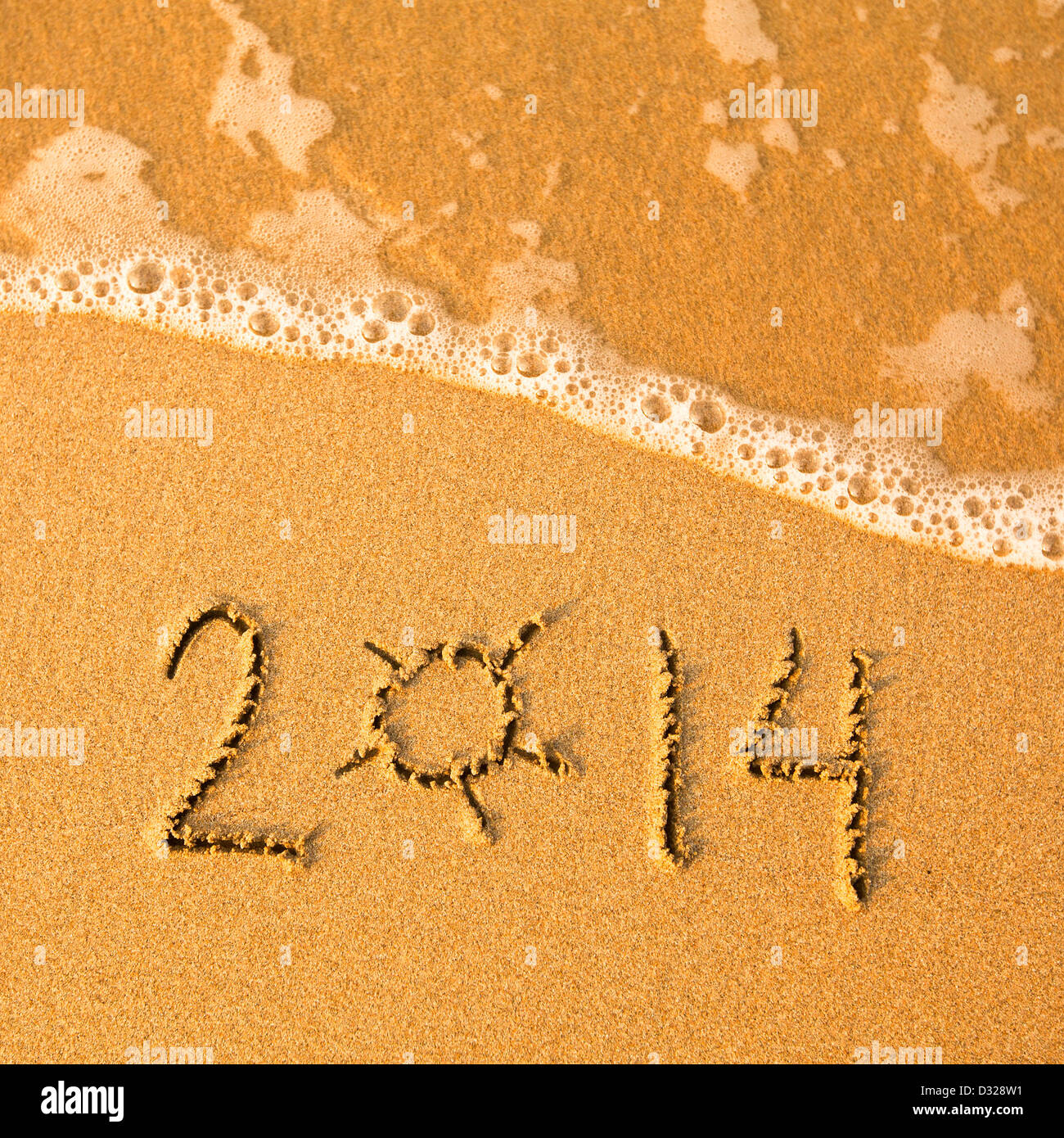 2014 written in sand on beach texture - soft wave of the sea Stock ...