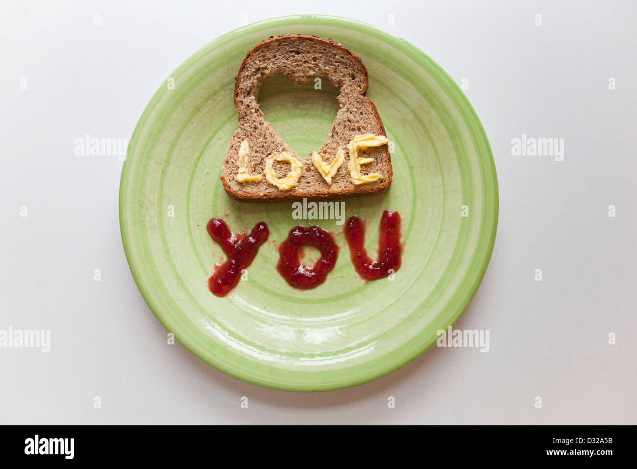 Romantic breakfast, 'love you' written with jam and butter Stock Photo ...