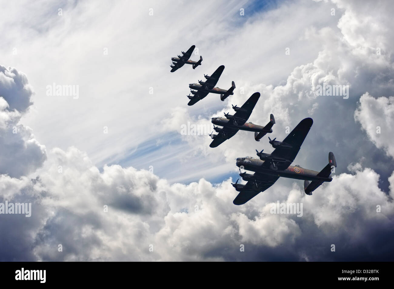 Flight formation of Battle of Britain World War Two consisting of Lancaster bombers banking right Stock Photo