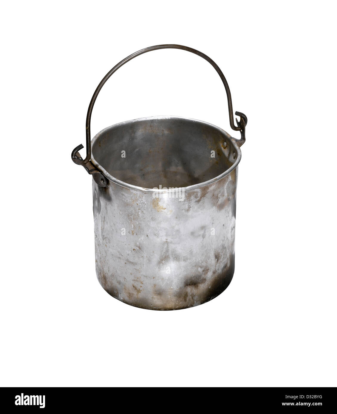 An old battered silver bucket with the handle up. Stock Photo