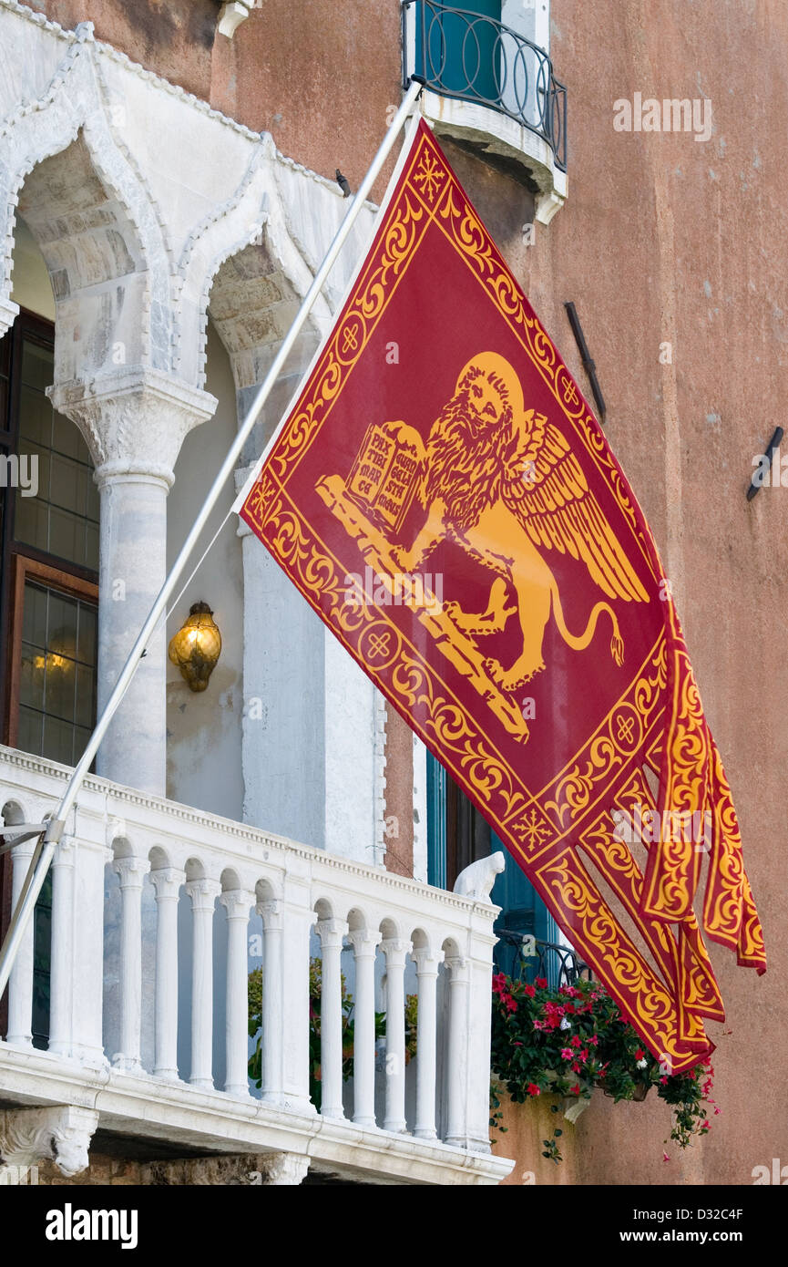 The Venetian Winged Lion emblem on a flag in Venice, Italy. Stock Photo