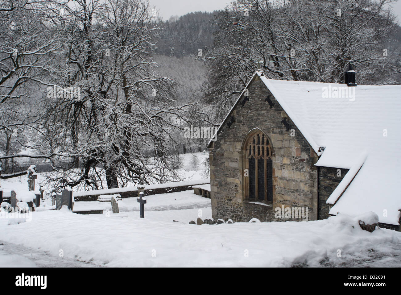 Snow at Llantysillio church and graveyard Llangollen Stock Photo