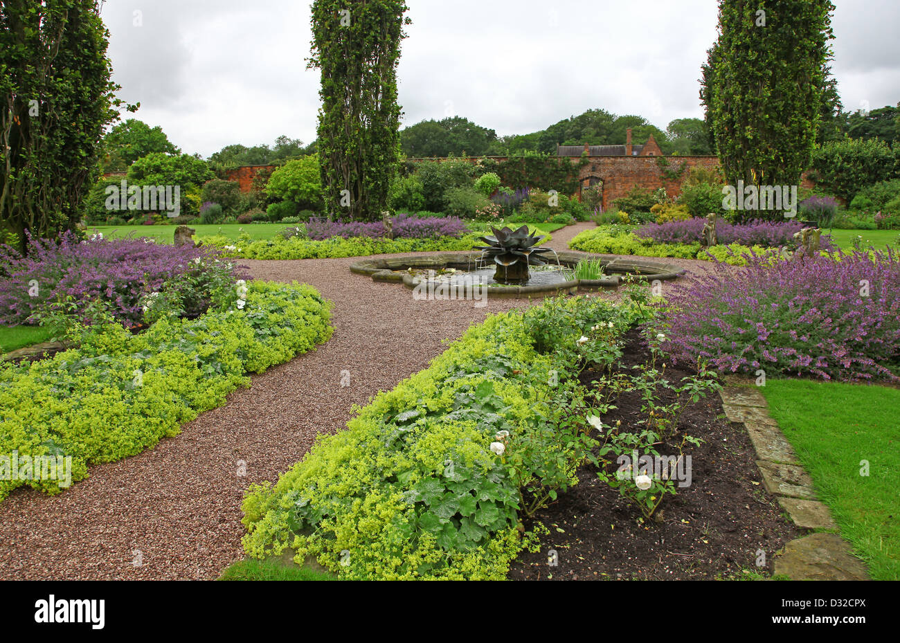 The Walled Garden with a pond surrounded by statues and a modern flower