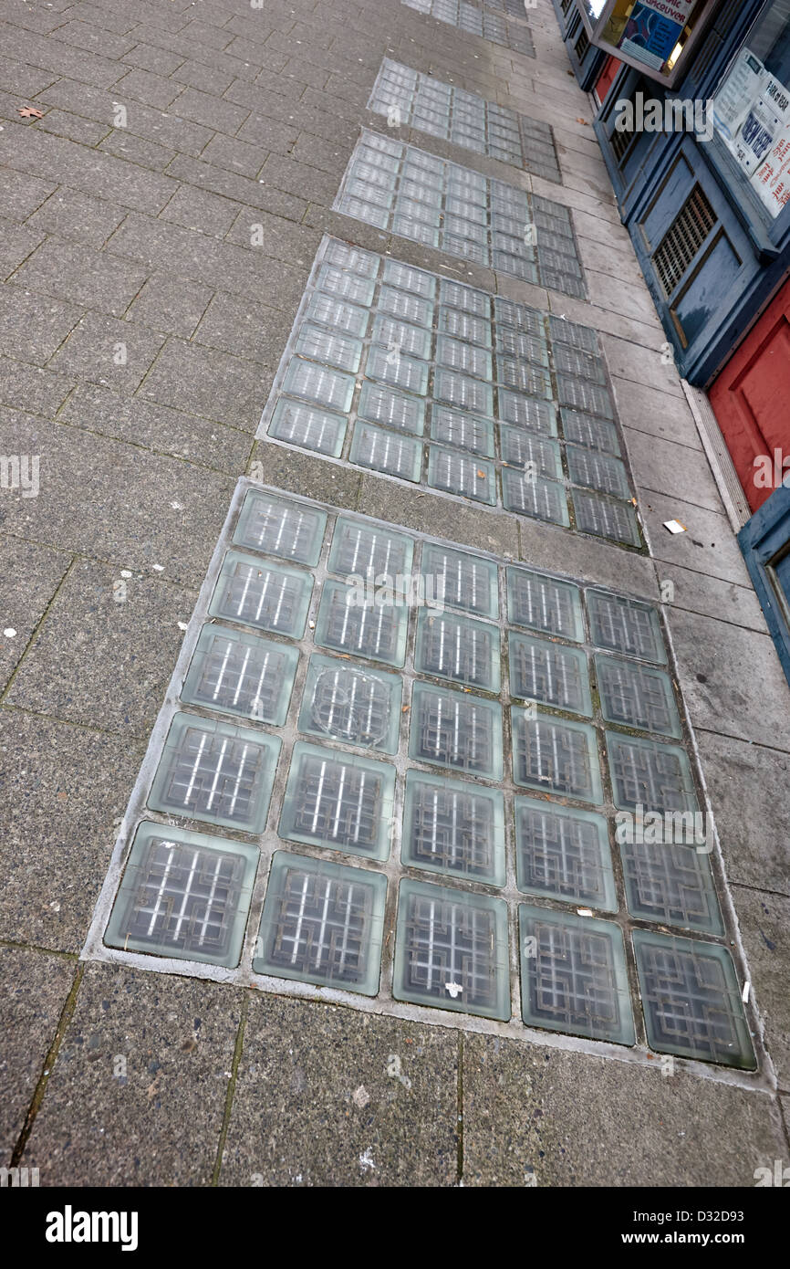 glass blocks in the sidewalk to light basement of the sam kee building