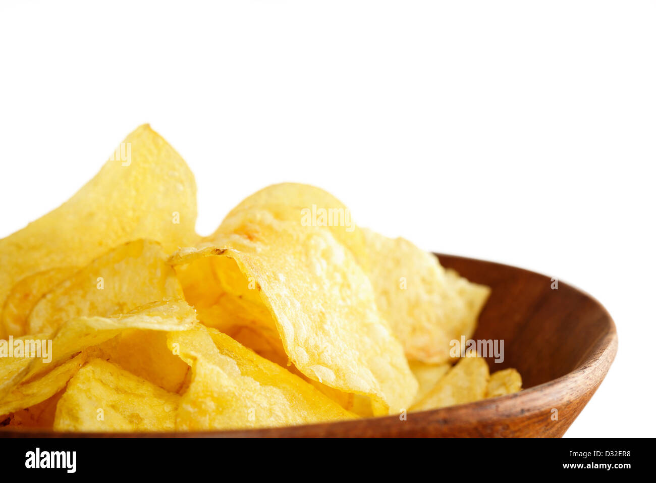 Crisps in a wooden bowl on white background Stock Photo Alamy