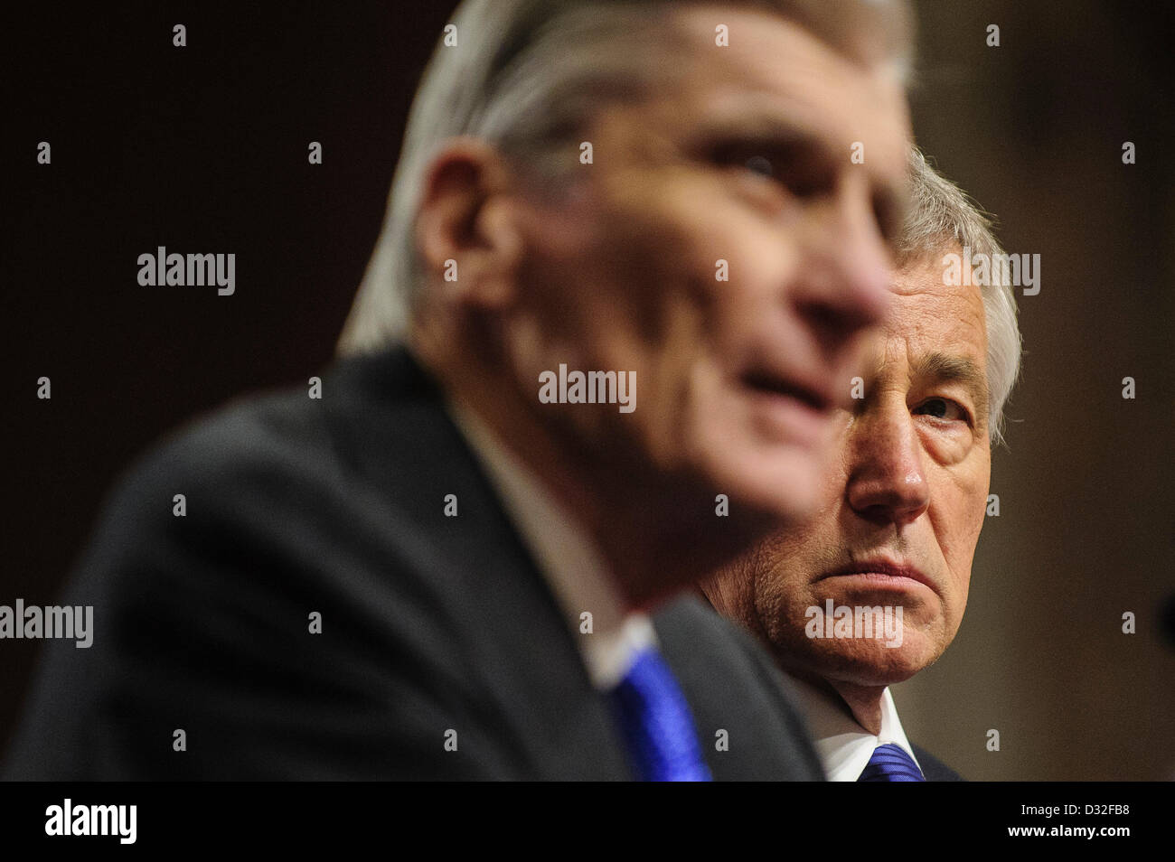 Jan. 31, 2013 - Washington, District of Columbia, U.S. - Former Senator Chuck Hagel (R-NE) looks on as former Senator John Warner Nunn (R-VA) makes his introductory speech to the Senate Armed Services Committe for former Senator Chuck Hagel (R-NE) who is President Obama's nominee to be Secretary of Defense. (Credit Image: © Pete Marovich/ZUMAPRESS.com) Stock Photo