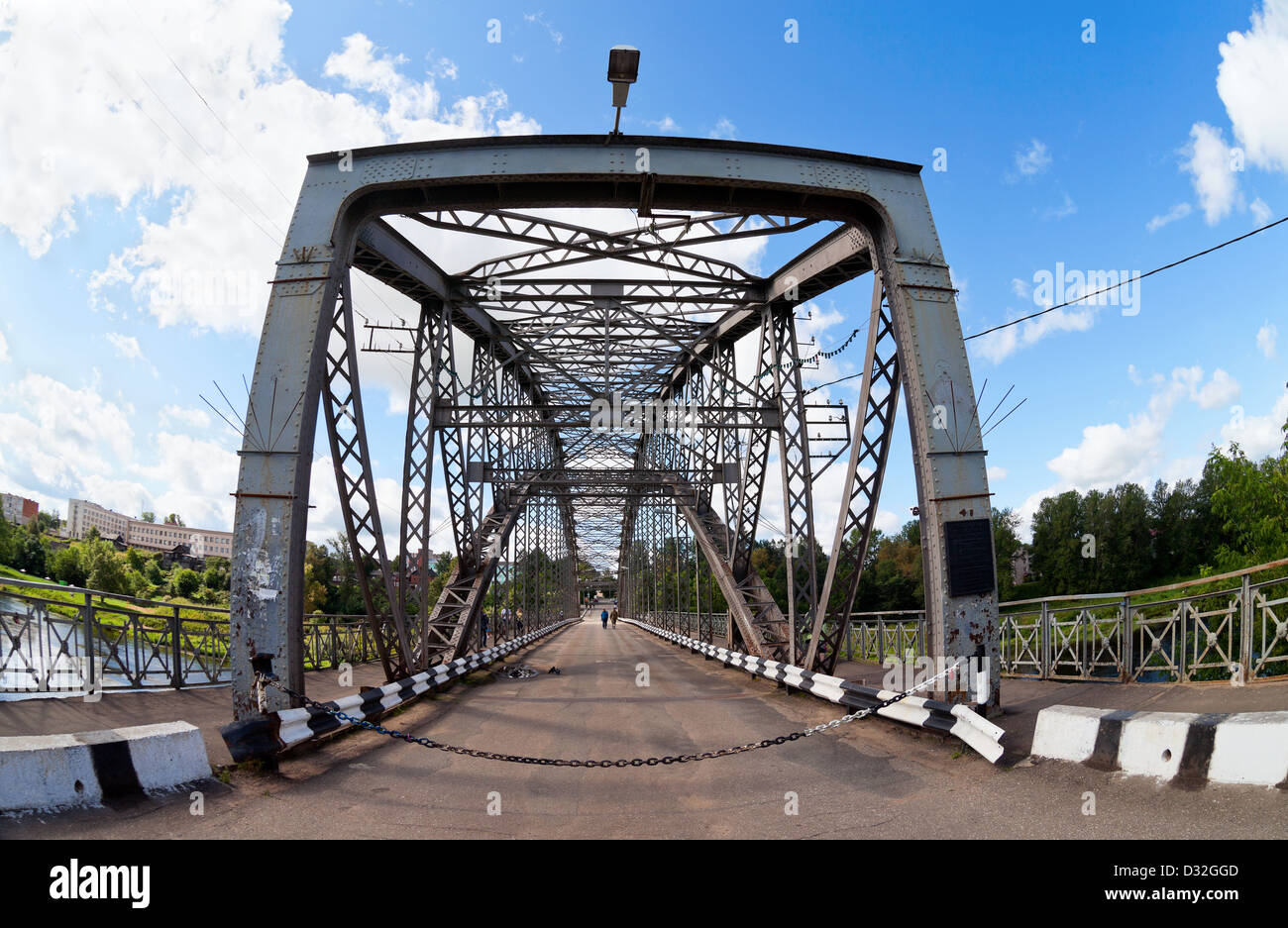 Steel Arch Bridge on river Msta. Novgorod region, Russia Stock Photo