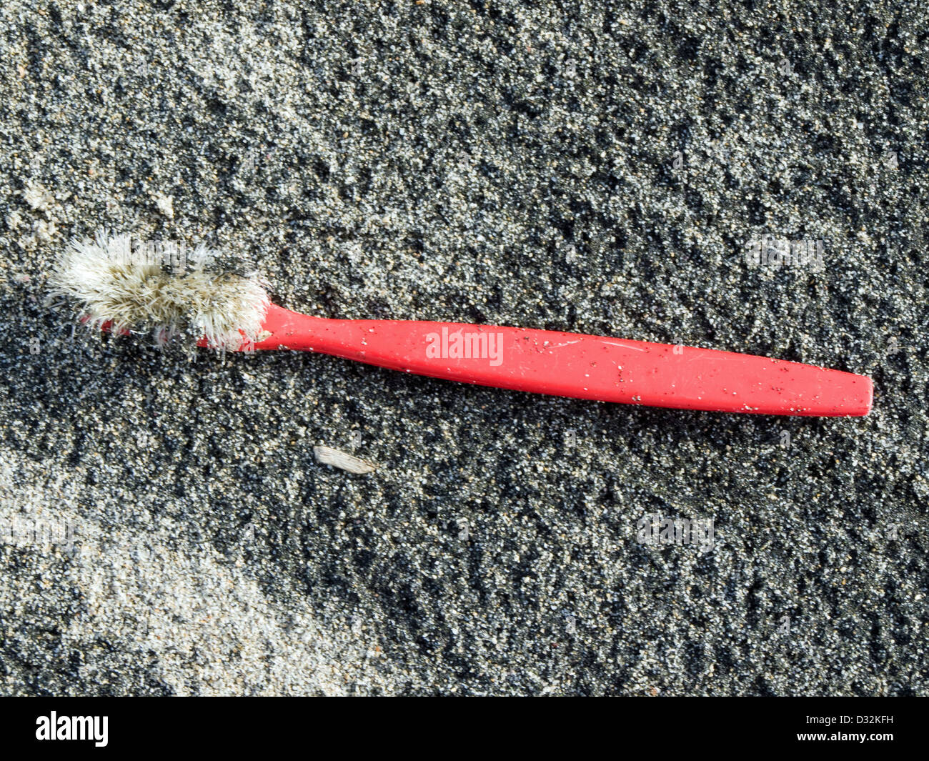 toothbrush - trash on the beach Stock Photo