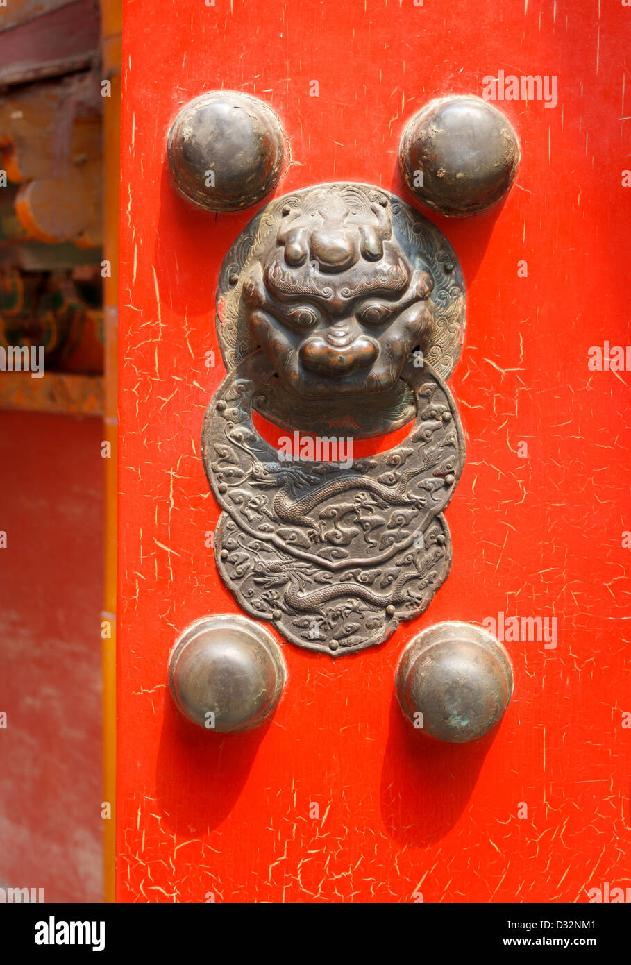 Traditional Chinese red door with a dragon (Jiaotu) head Stock Photo