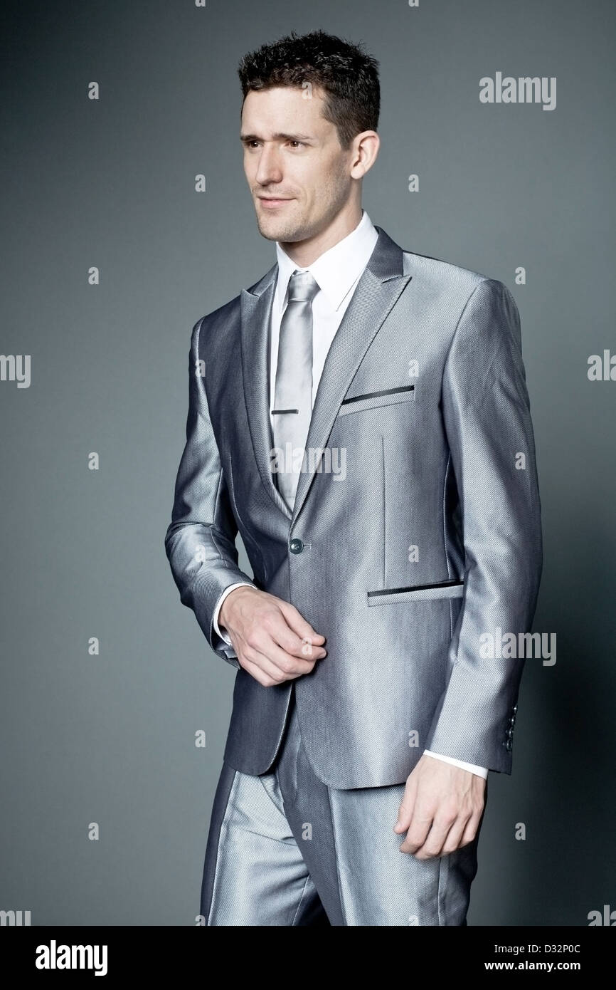 Young happy businessman in gray suit Stock Photo - Alamy