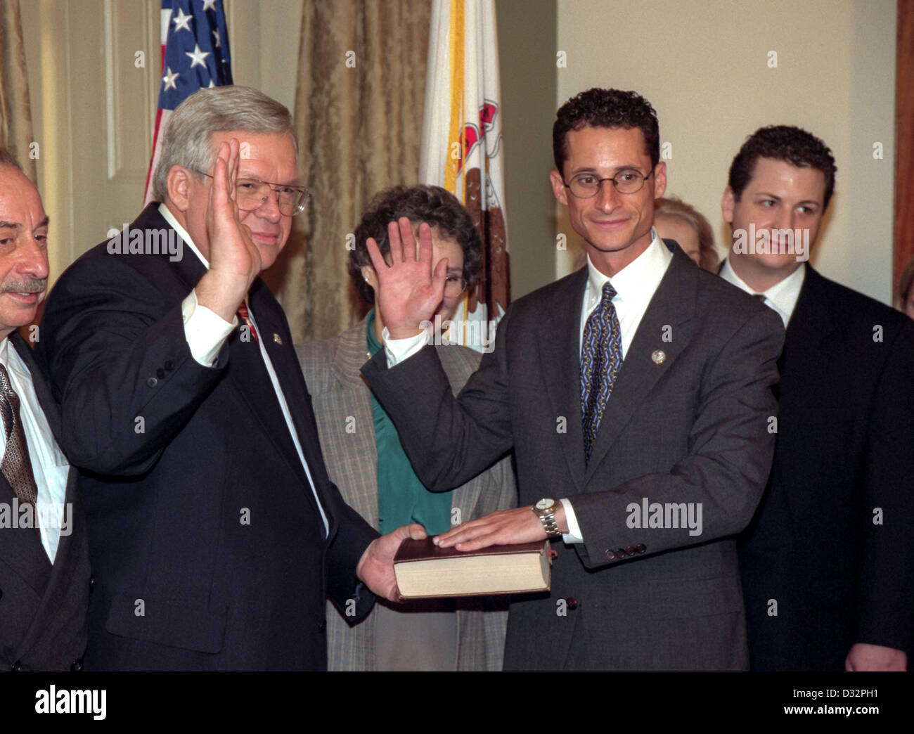Speaker of the House Denis Hastert (L) administers the oath of office to Rep. Alan Weiner of New York as his family looks on January 6, 1999 at the start of the 106th Congress. The oath is a recreation as the formal oath is administered to the entire congress as a body on the floor of the House. Stock Photo