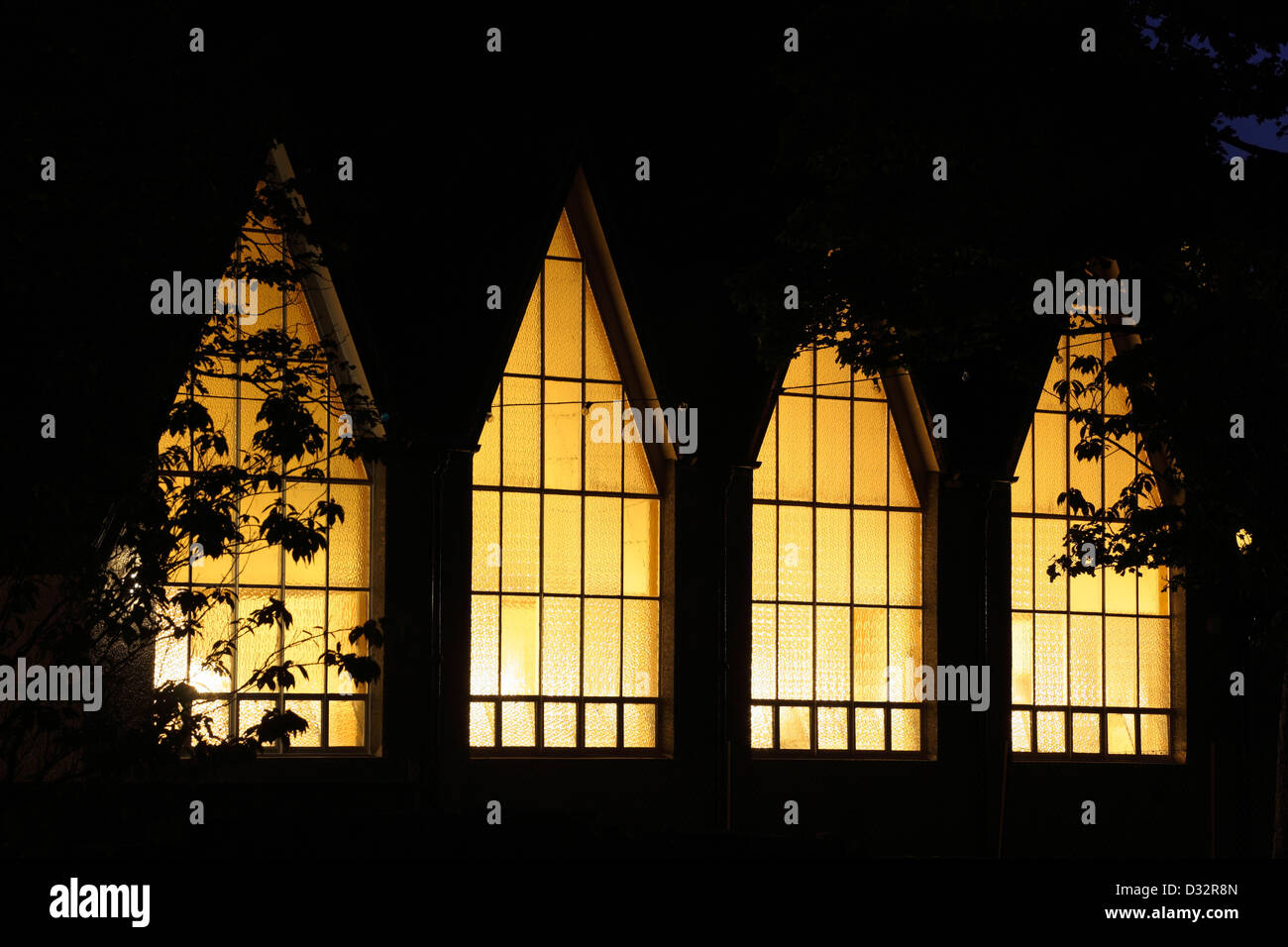Illuminated windows of St Marys Star Of The Sea Roman Catholic Parish Church, Largs, North Ayrshire, Scotland, UK Stock Photo