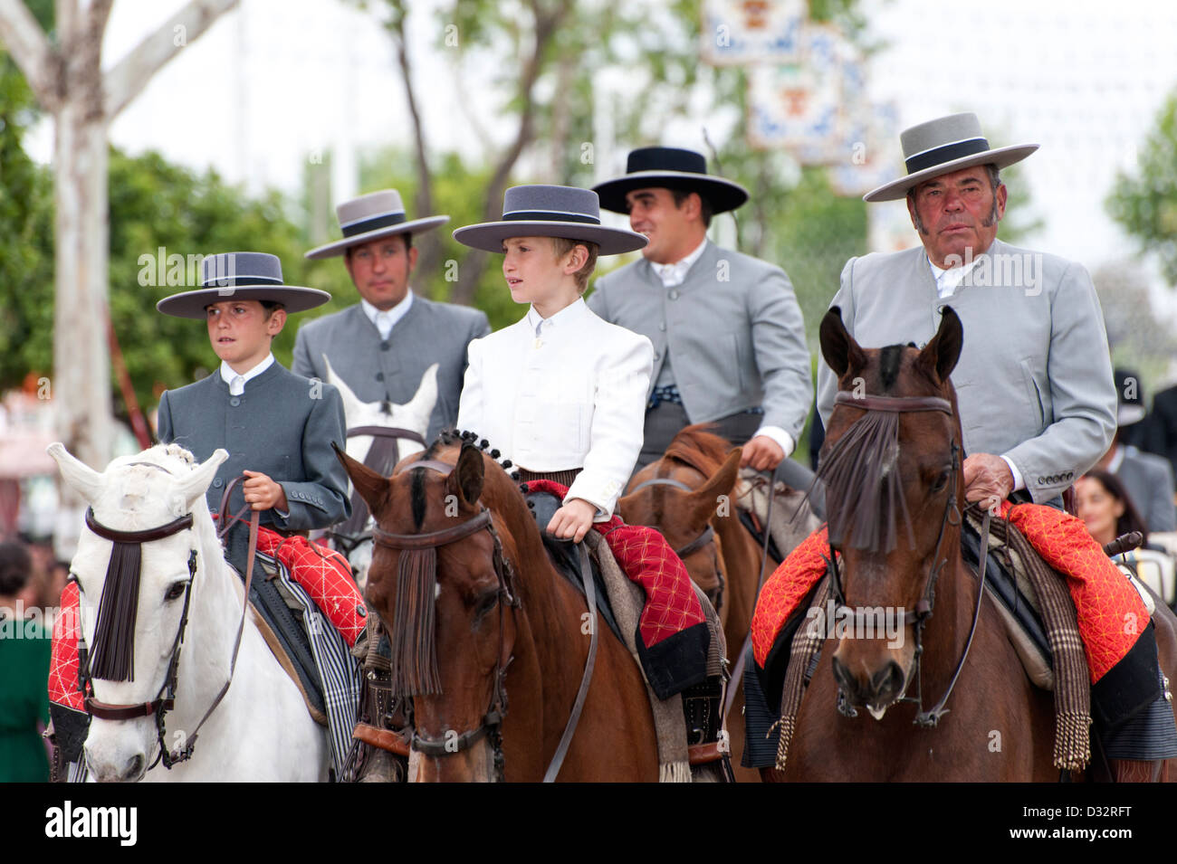 Men and children riding horses during the Feria de Seville ...