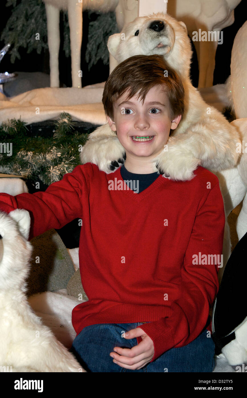 Boy and stuffed animal polar bears Stock Photo